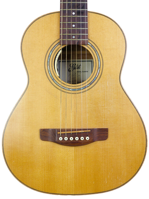 Beautiful Gilet Travel SS Guitar with a sleek wooden body and neck, perfect for musicians on the go.
