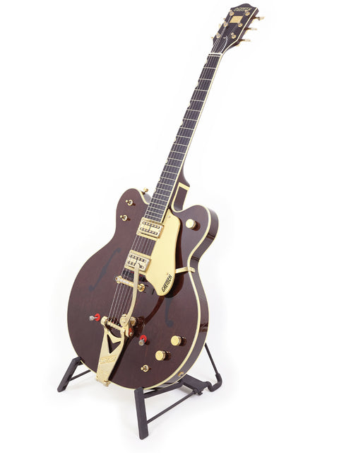 Beautiful Gretsch 6122T Chet Atkins guitar featuring a warm brown body and luxurious gold hardware, ideal for any music lover.