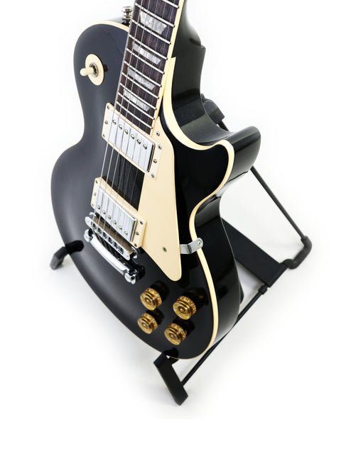 Black 1995 Gibson Les Paul Standard guitar, highlighting its classic shape and premium build quality.
