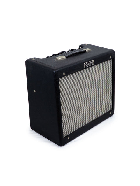 Black Fender guitar amplifier on a white background.