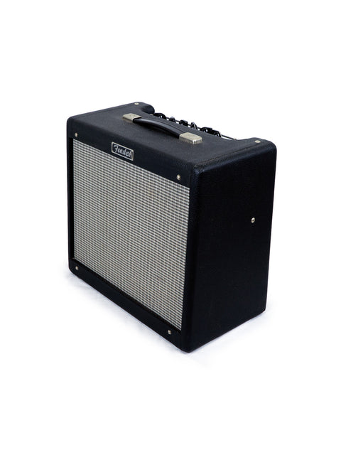Black Fender guitar amplifier on a white background.