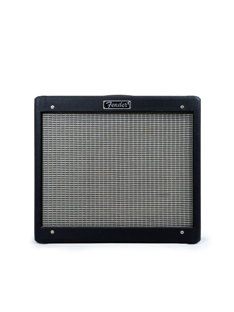 Black Fender guitar amplifier on a white background.