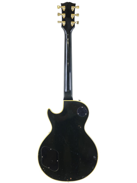 Black Gibson Les Paul Custom electric guitar with a gold headstock, a vintage model from 1969, USA-made.