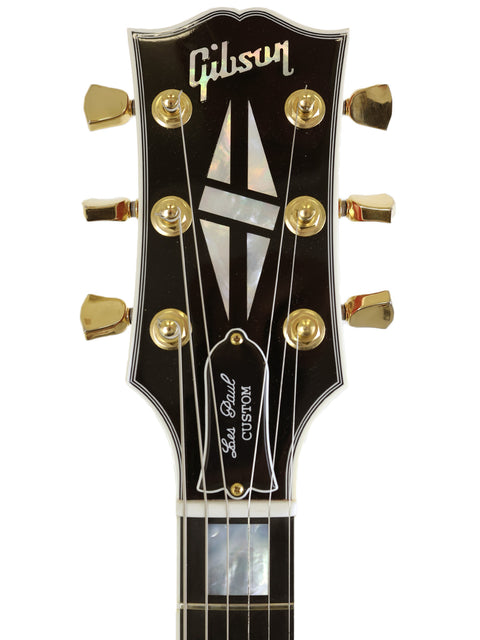 Black Gibson Les Paul Custom from the Custom Shop, USA, 2014, showcasing its sleek design and premium craftsmanship.