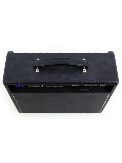 Black Quilter Aviator Gold 8” Combo guitar amplifier on a white surface, showcasing its sleek design and compact size.