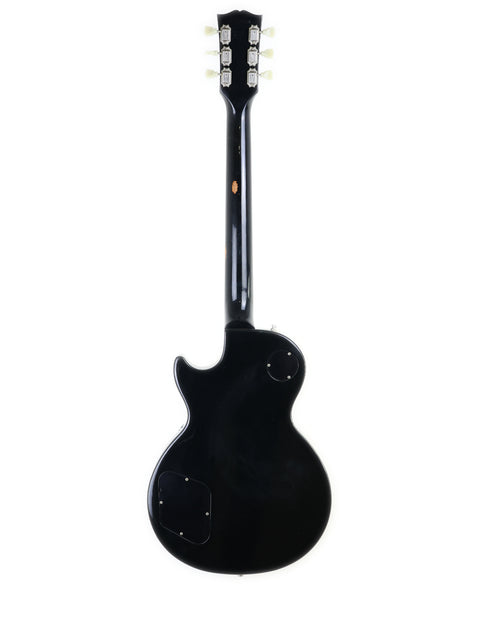  Black electric guitar, a 1995 Gibson Les Paul Standard, showcasing a white pickguard for a classic look.