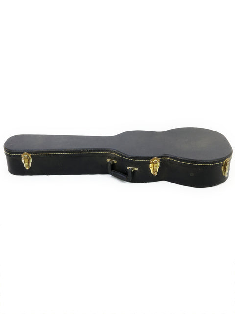 Black guitar case with gold hardware, marked with "Gilet Bay State - Australia 2018."