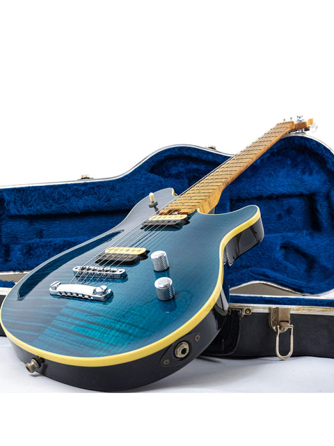 Blue Peavey EVH Wolfgang Standard Hardtail electric guitar in a protective case, showcasing its sleek design.