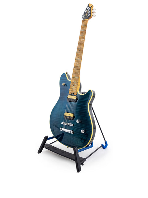 Blue Peavey EVH Wolfgang Standard Hardtail guitar displayed on a stand with a clean white backdrop.