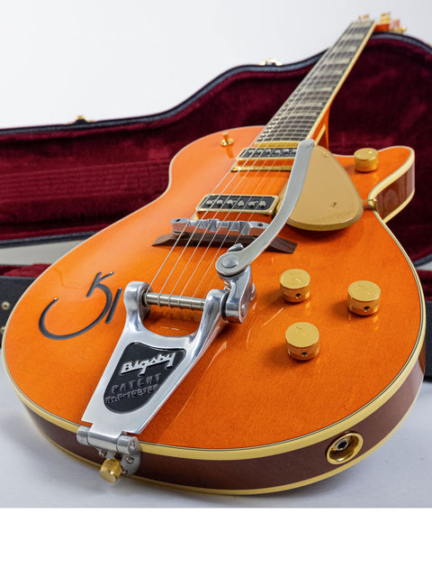 Bright orange Gretsch GS-1 electric guitar, featuring the 2003 Japan Roundup 6121W Reissue design.