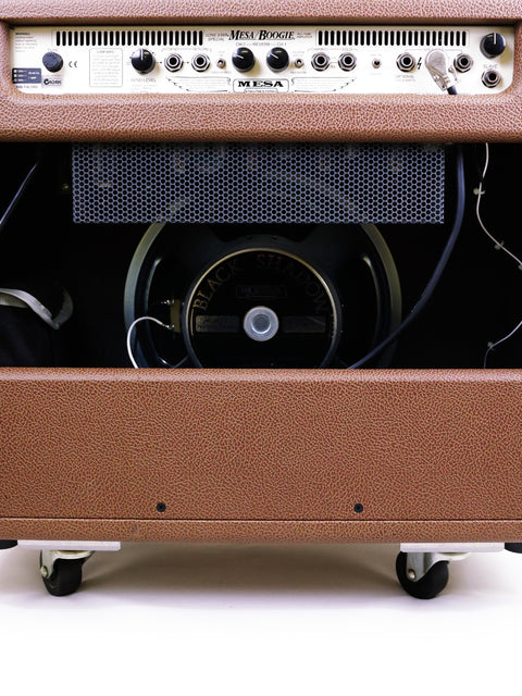 Brown guitar amplifier, Mesa Boogie Lonestar Special 1x12 Combo, positioned on a white surface, displaying its unique design.