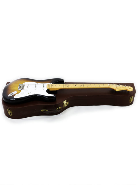 Brown guitar case displayed on a white background, showcasing the Fender Custom Shop 50th Anniversary ‘54 Stratocaster LE.
