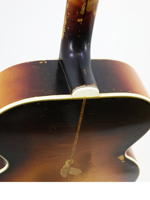 Classic 1930s Gibson J-45 acoustic guitar, representing the timeless style and quality of vintage American craftsmanship.