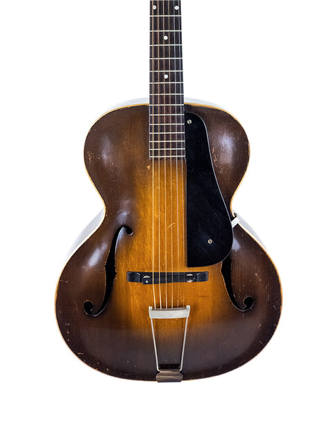 Classic 1951 Gibson J-45 guitar with a sunburst finish, representing vintage craftsmanship, next to a 1935 Epiphone Masterbilt Zenith.