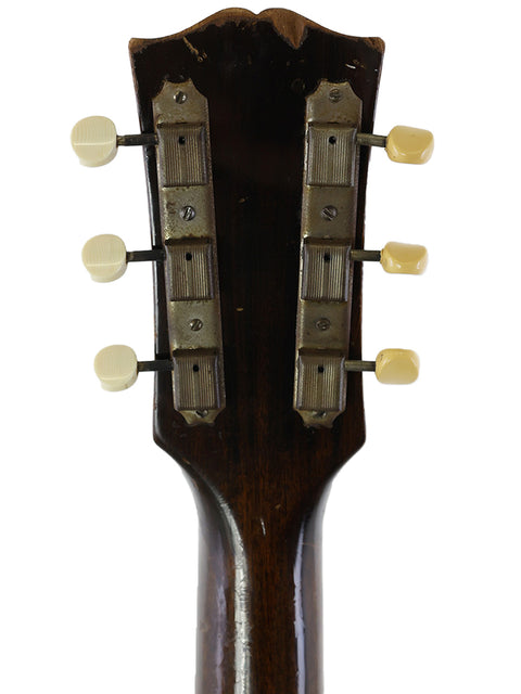 Classic 1955 Gibson Les Paul Custom, featuring a sleek design and vintage appeal, perfect for collectors.