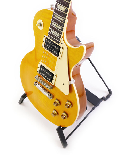 Classic 1960 Reissue Gibson Les Paul Standard in yellow, a 1991 USA model known for its rich tone and elegant design.