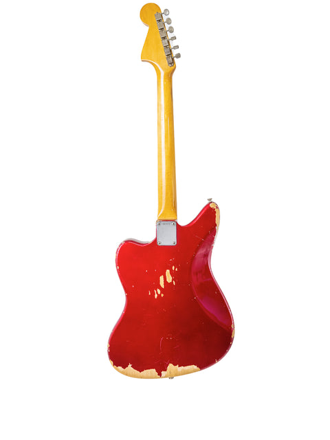 Classic 1964 Fender Jaguar guitar in Candy Apple Red, complemented by a yellow body and neck, perfect for collectors.