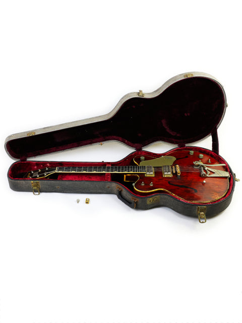 Classic 1964 Gretsch 6122 Country Gentleman guitar in vibrant red, complete with a stylish case, ideal for any music lover.
