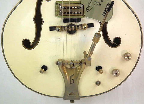 Classic 1968 Gretsch 6136 White Falcon guitar featuring a striking gold pickguard and headstock, ideal for any music lover.