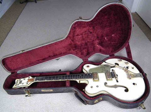 Classic 1968 Gretsch 6136 White Falcon guitar resting in its case, an ideal choice for serious guitar enthusiasts.