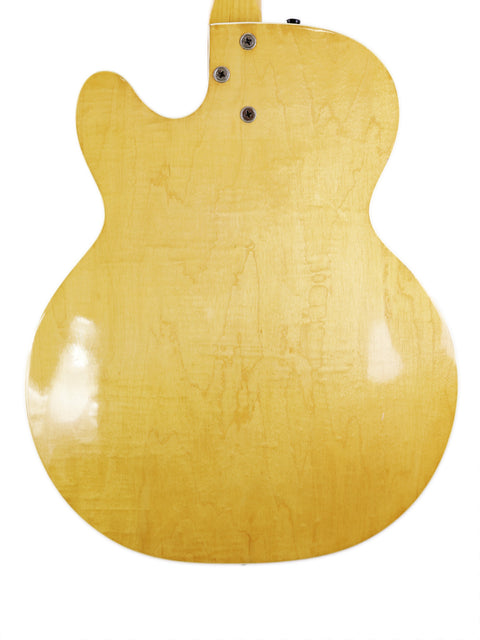 Classic yellow Harmony H71 Meteor guitar from 1960-61, showcased against a bright white background for a striking visual appeal.