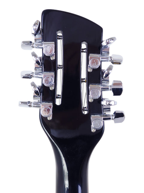 Close-up image of the headstock from a 2020 Rickenbacker 330 12-string electric guitar, emphasizing its elegant design and tuning pegs.