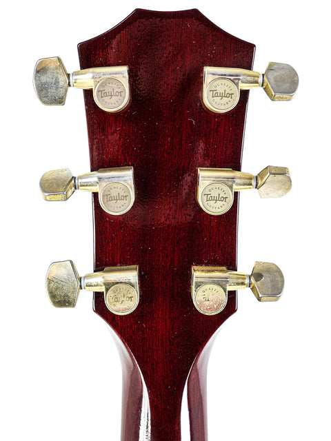Close-up image of the headstock of a 2010 Taylor T5-C1 acoustic guitar, emphasizing its unique design and quality.