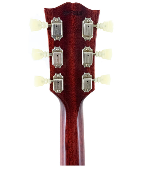 Close-up image of the headstock on a Gibson Custom ’61 Les Paul SG Standard acoustic guitar, emphasizing its intricate details.