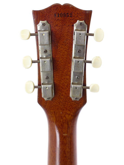 Close-up of a 1959 Gibson Les Paul Jr headstock showcasing four knobs for tone and volume control.