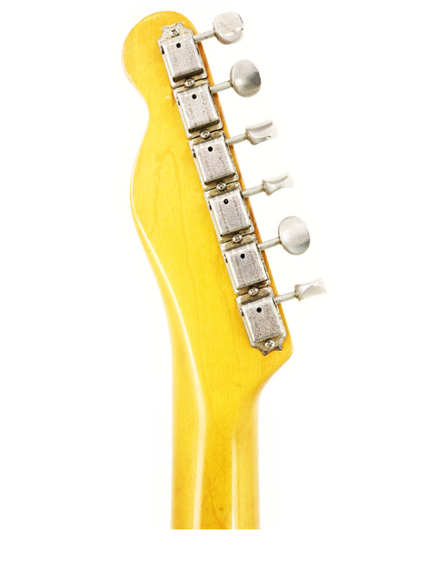 Close-up of a 1966 Fender Custom Telecaster headstock, emphasizing its yellow body and vintage craftsmanship.