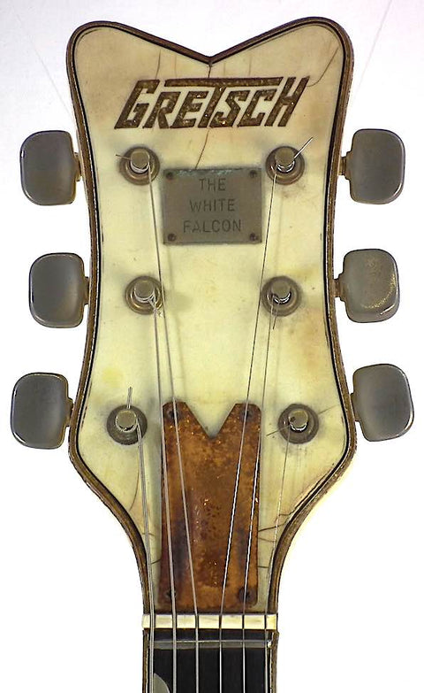 Close-up of a 1968 Gretsch 6136 White Falcon guitar headstock, showcasing its vintage elegance and craftsmanship.
