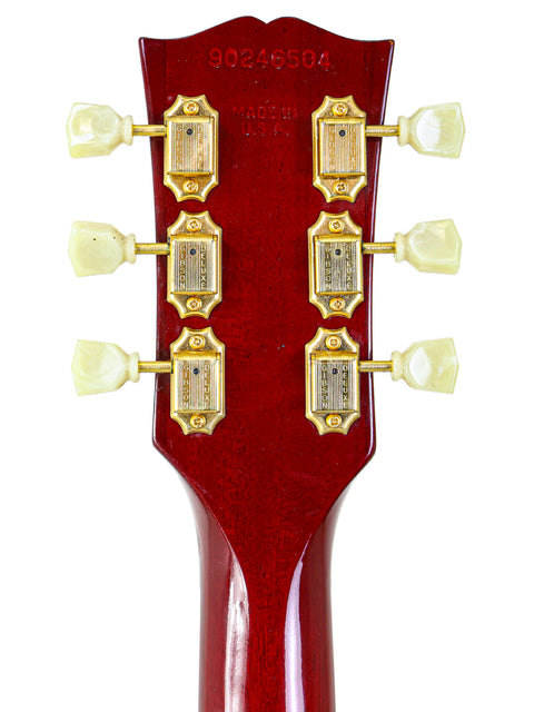 Close-up of a 1997 Gibson Nighthawk electric guitar headstock, showcasing its distinctive design and tuning pegs.