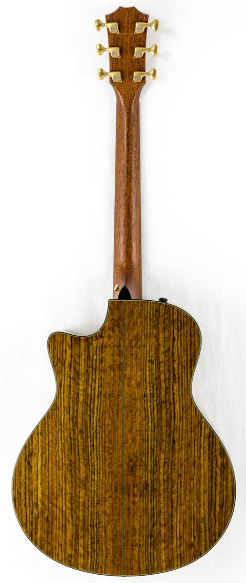 Close-up of a 2011 Taylor Custom GS Baritone 6 guitar, highlighting its stunning wooden back and neck.