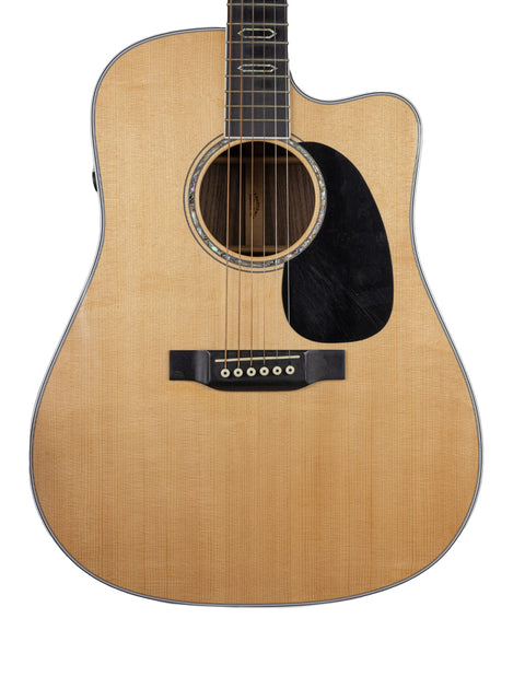 Close-up of a 2019 Martin DC Aura GT Dreadnought guitar, highlighting its beautiful craftsmanship and acoustic features.