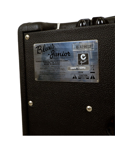 Close-up of a Blues Junior guitar amplifier with visible details on the nameplate.