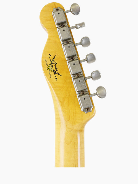 Close-up of a Fender Limited Edition ’60s Telecaster Thinline headstock with a yellow body, showcasing its vintage design.