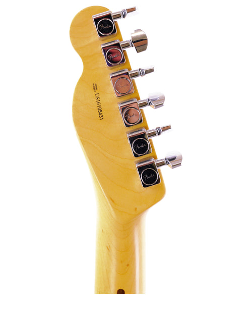 Close-up of a Fender guitar headstock with tuning pegs isolated on white background.