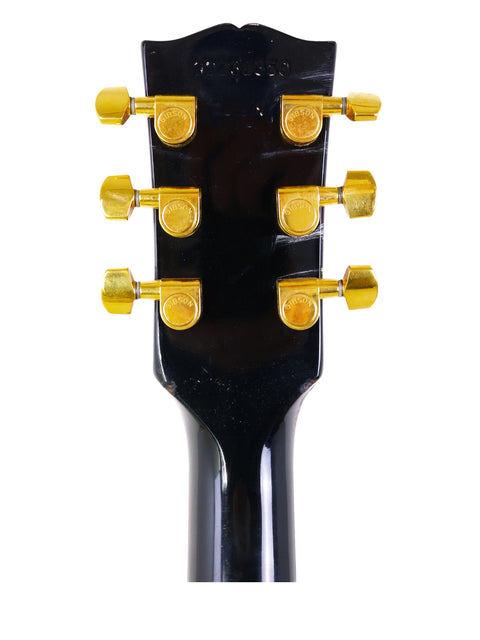 Close-up of a Gibson Chet Atkins SST headstock, showcasing its intricate design and craftsmanship from 1998.
