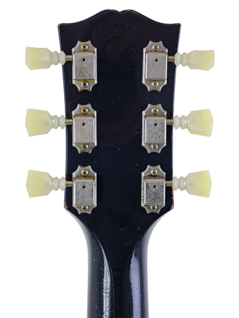 Close-up of a Gibson Custom Shop '64 SG Murphy Lab headstock, showcasing its intricate design and craftsmanship.