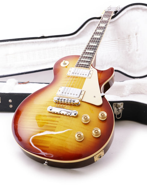 Close-up of a Gibson Les Paul Traditional guitar in its case, highlighting the iconic model from USA 2013.