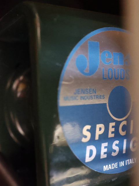 Close-up of a "Jensen Loudspeakers Special Design" label on a speaker, indicating "Made in Italy."
