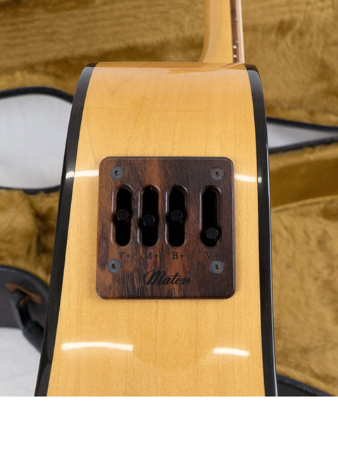 Close-up of a Maton Stage Delux Rock Maple acoustic guitar neck, showcasing its smooth wood grain and intricate fret details.