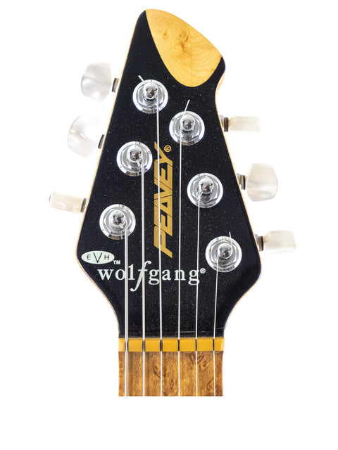 Close-up of a Peavey EVH Wolfgang Standard Hardtail guitar headstock, showcasing its design and craftsmanship from 1999.