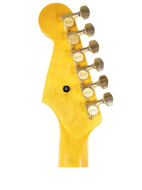Close-up of a guitar head featuring a yellow body, identified as a Levinson Blade R2 from Japan, made in 1989.