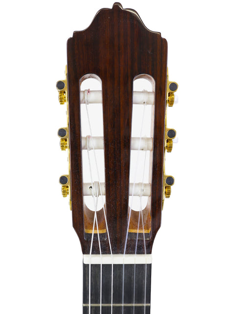 Close-up of a guitar neck with a wooden headstock, showcasing the Francisco Esteve 9C/B Classical from Spain, 2021.