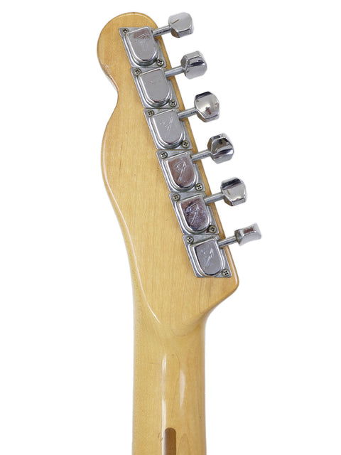 Close-up of a vintage Fender Telecaster guitar head from 1977-78, set against a white background.