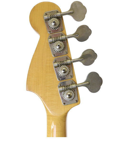 Close-up of an Ibanez Silver Series P/J Bass guitar head from 1978, featuring four tuning knobs and intricate details.