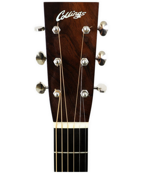 Close-up of the headstock from a 2006 Collings D2H acoustic guitar, highlighting its fine details and quality.