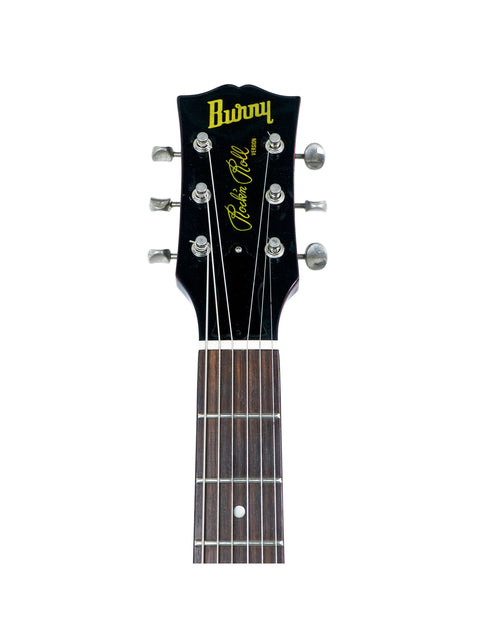 Close-up of the headstock of a Burny Les Paul Jr acoustic guitar from the 1980s, showcasing its vintage design and craftsmanship.