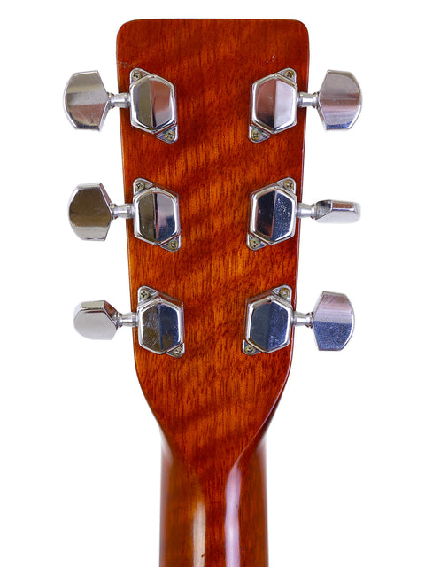 Close-up of the headstock of a K. Yairi W1S acoustic guitar from Japan, made in 1983, showcasing its intricate design.